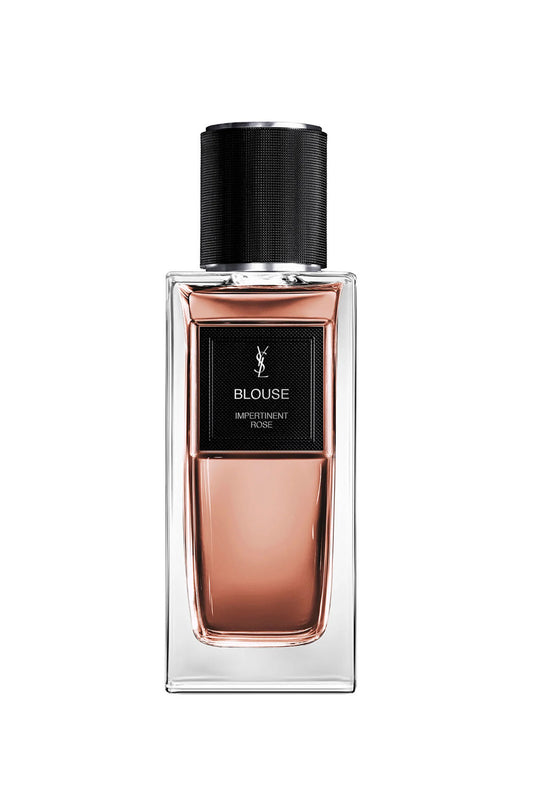Perfume bottle with black cap and rose gold body on a white background