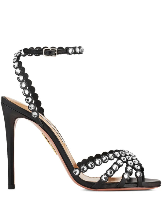 Black high-heeled sandal with bead embellishments on a white background