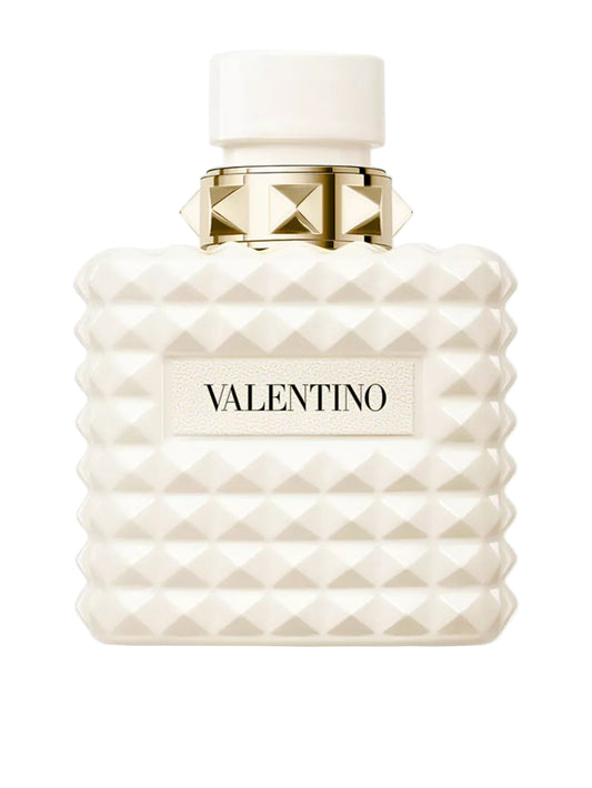 Valentino perfume bottle with white diamond pattern and gold cap on a white background