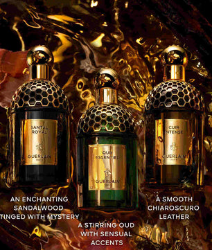 Three Guerlain perfume bottles with descriptive text on a dark, textured background.