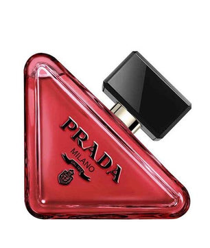 Red triangular Prada perfume bottle on a white background