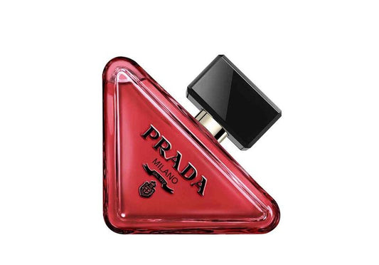 Red triangular Prada perfume bottle on a white background