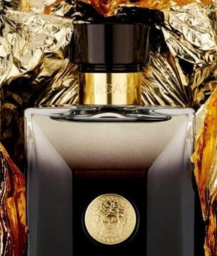 Luxurious perfume bottle with gold accents on a black background