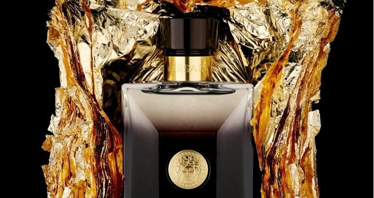 Luxurious perfume bottle with gold accents on a black background