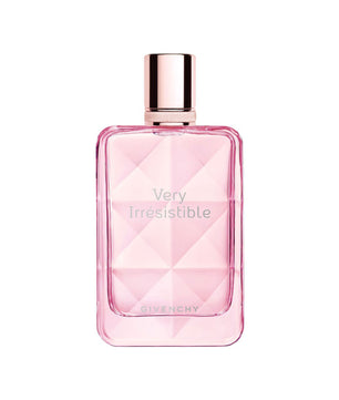 A pink Givenchy Very Irresistible perfume bottle with a faceted geometric design and a metallic rose gold cap, centered on a plain white background.