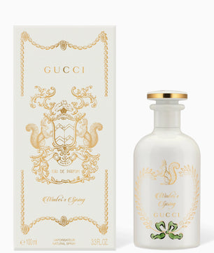 Gucci perfume bottle and packaging on a white background