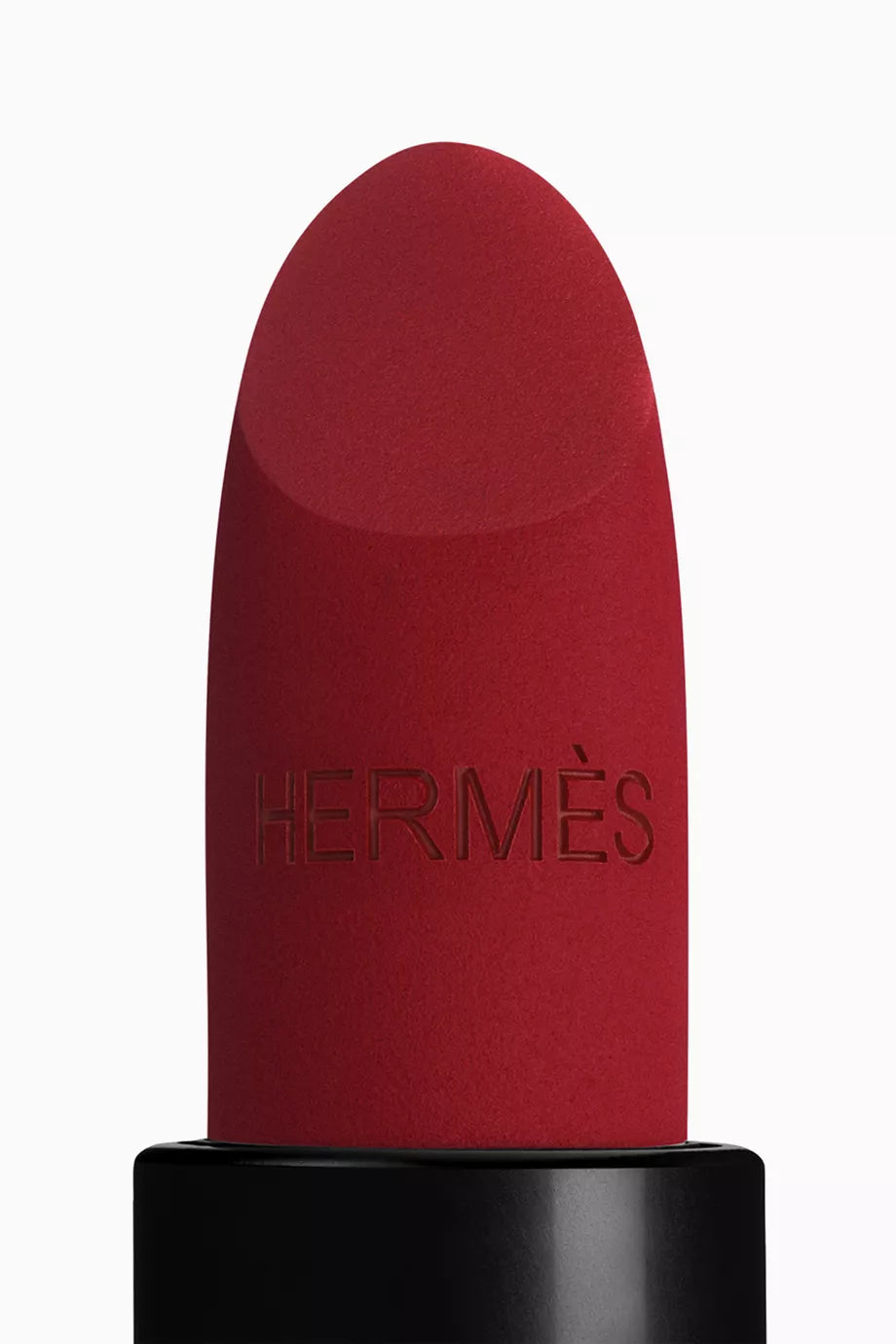 Red lipstick with black base and 'Hermès' branding on a white background
