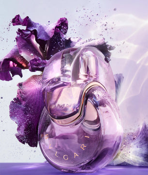 Viktor & Rolf Flower by Olfactus perfume bottle with purple flowers on a light purple background