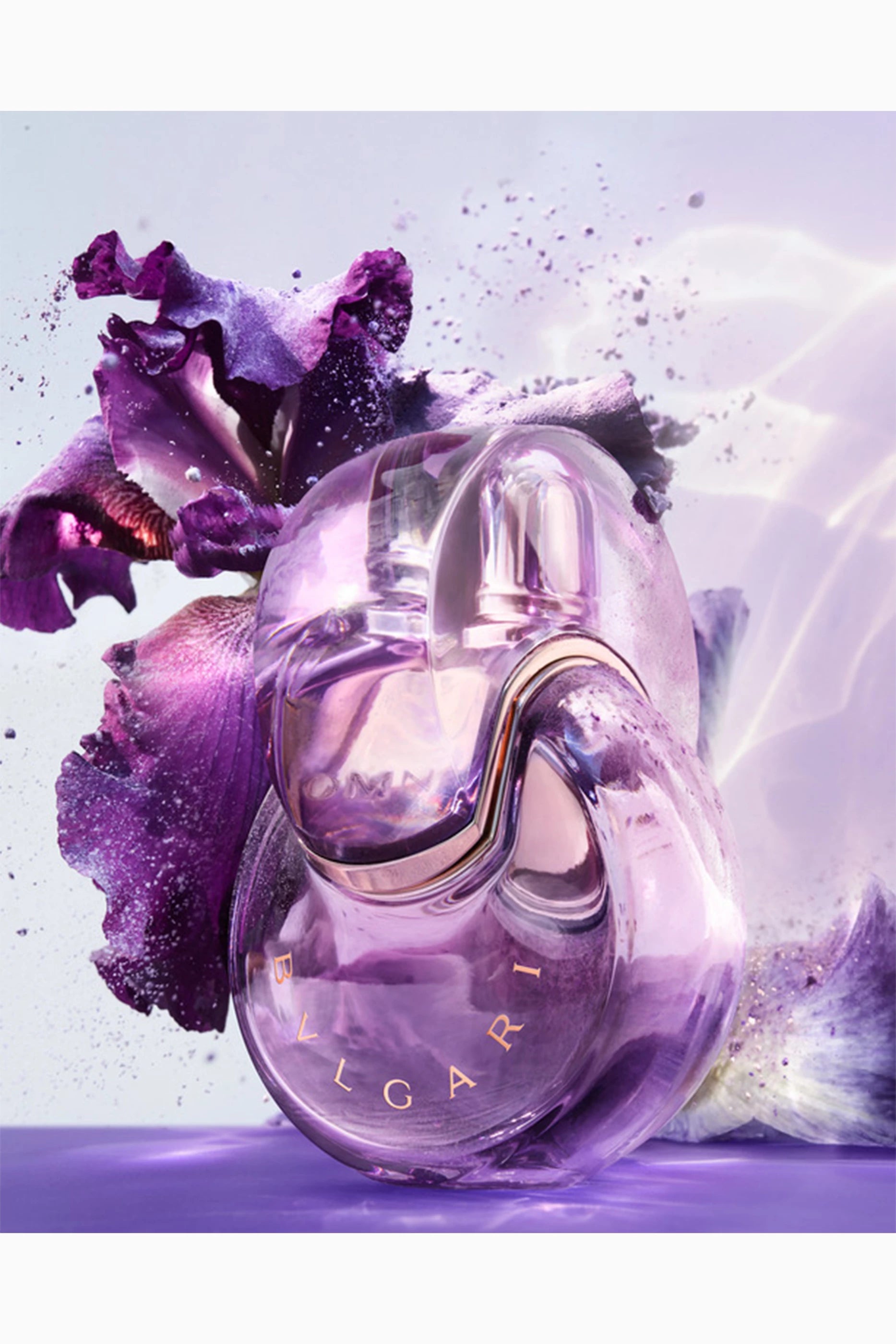 Viktor & Rolf Flower by Olfactus perfume bottle with purple flowers on a light purple background