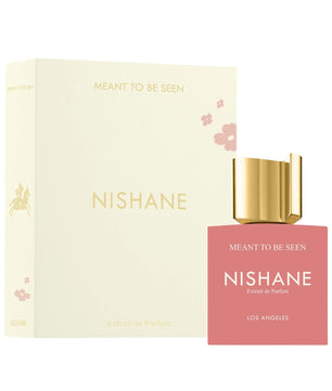 Nishane 'Meant to be Seen' Extrait de Parfum bottle and its matching cream-colored packaging box, featuring a gold cap and a pink bottle body.