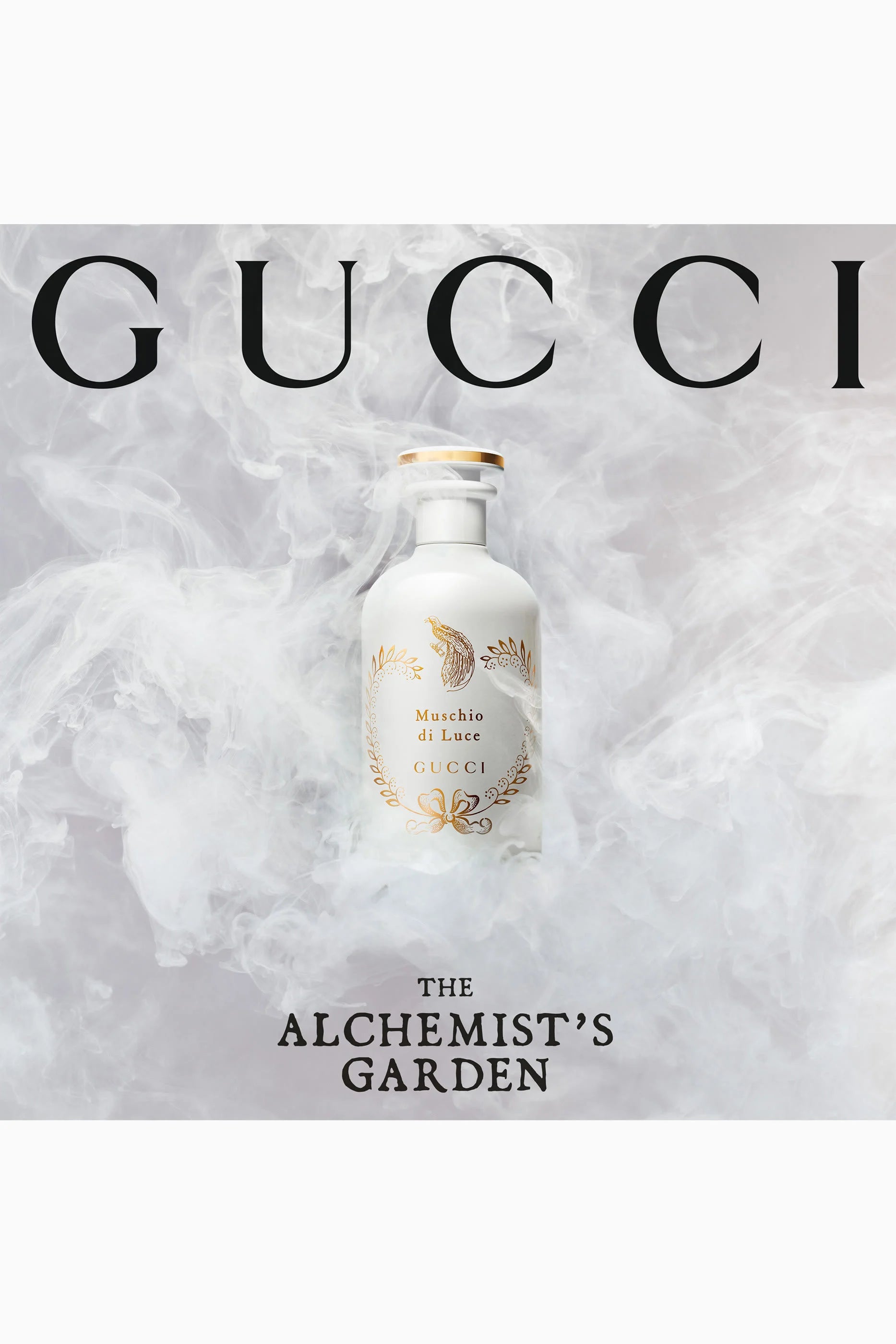 Gucci perfume bottle from 'The Alchemist's Garden' fragrance line, set against a smoky white and gray background with the brand name 'GUCCI' in large black letters at the top.