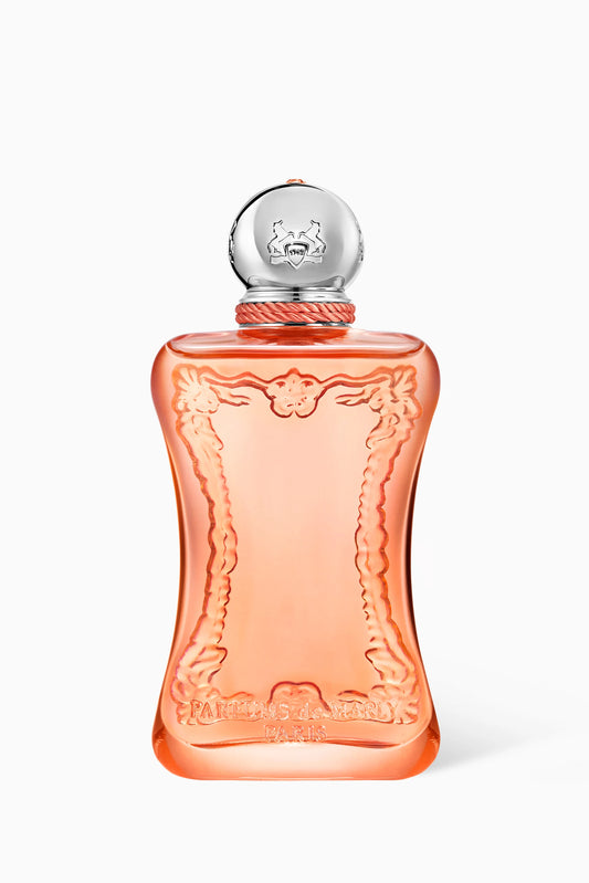A bottle of Marc Jacobs Daisy perfume with a translucent peach-colored glass body, featuring an embossed floral border design and a silver spherical cap with the Marc Jacobs dog logo.