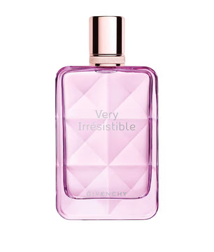 Pink Givenchy perfume bottle with rose gold cap on a white background