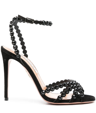 Black high-heeled sandal with bead embellishments on a white background