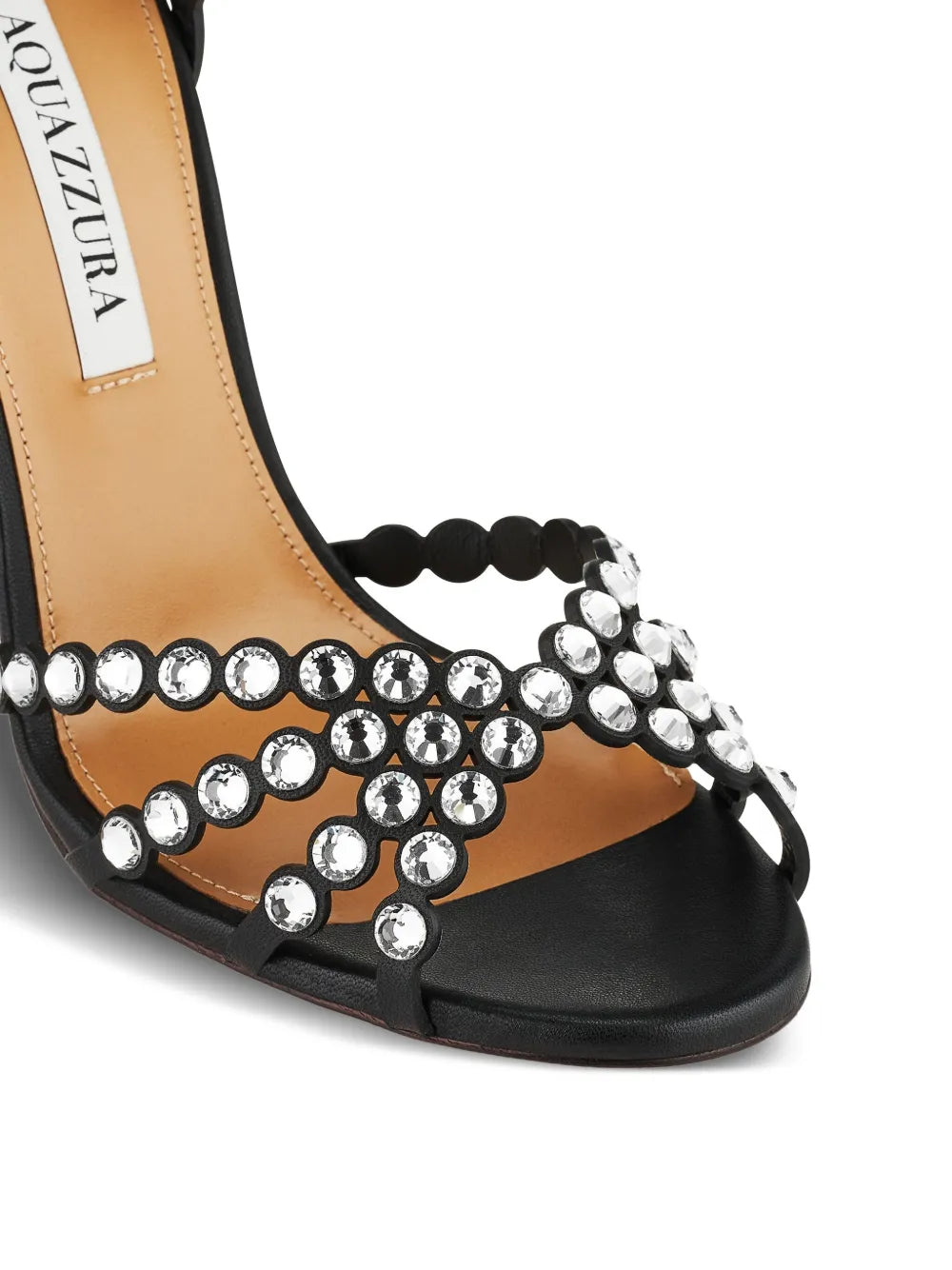 Black sandal with silver embellishments on a white background