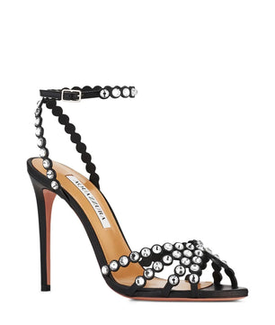 Black high-heeled sandal with pearl embellishments on a white background