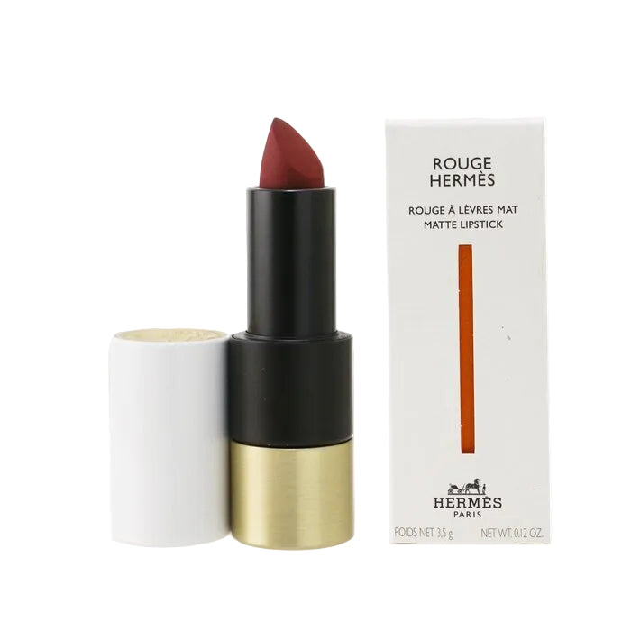Hermes lipstick with black and gold casing and white box on a white background