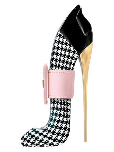 High-heeled shoe with houndstooth pattern and pink band on a white background
