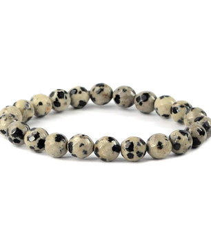Beaded bracelet with black and white pattern on a white background