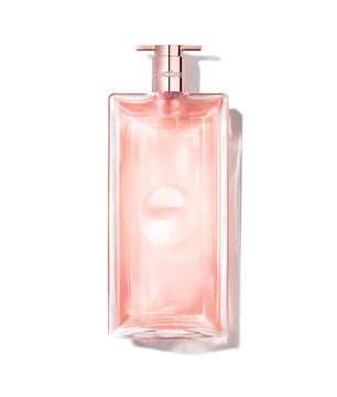 Pink perfume bottle with a metallic pump on a white background