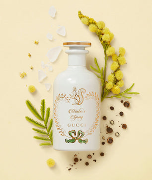 Gucci beauty product with floral elements on a beige background