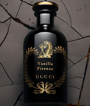 Gucci Vanilla Firenze perfume bottle on a textured gray background