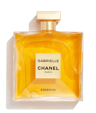 Chanel Gabrielle Essence perfume bottle with a square shape, filled with golden-yellow liquid and featuring a gold cap, set against a plain white background with a soft shadow.