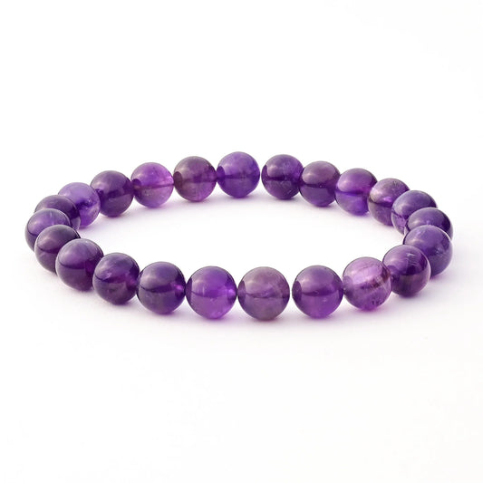 Purple beaded bracelet on a white background