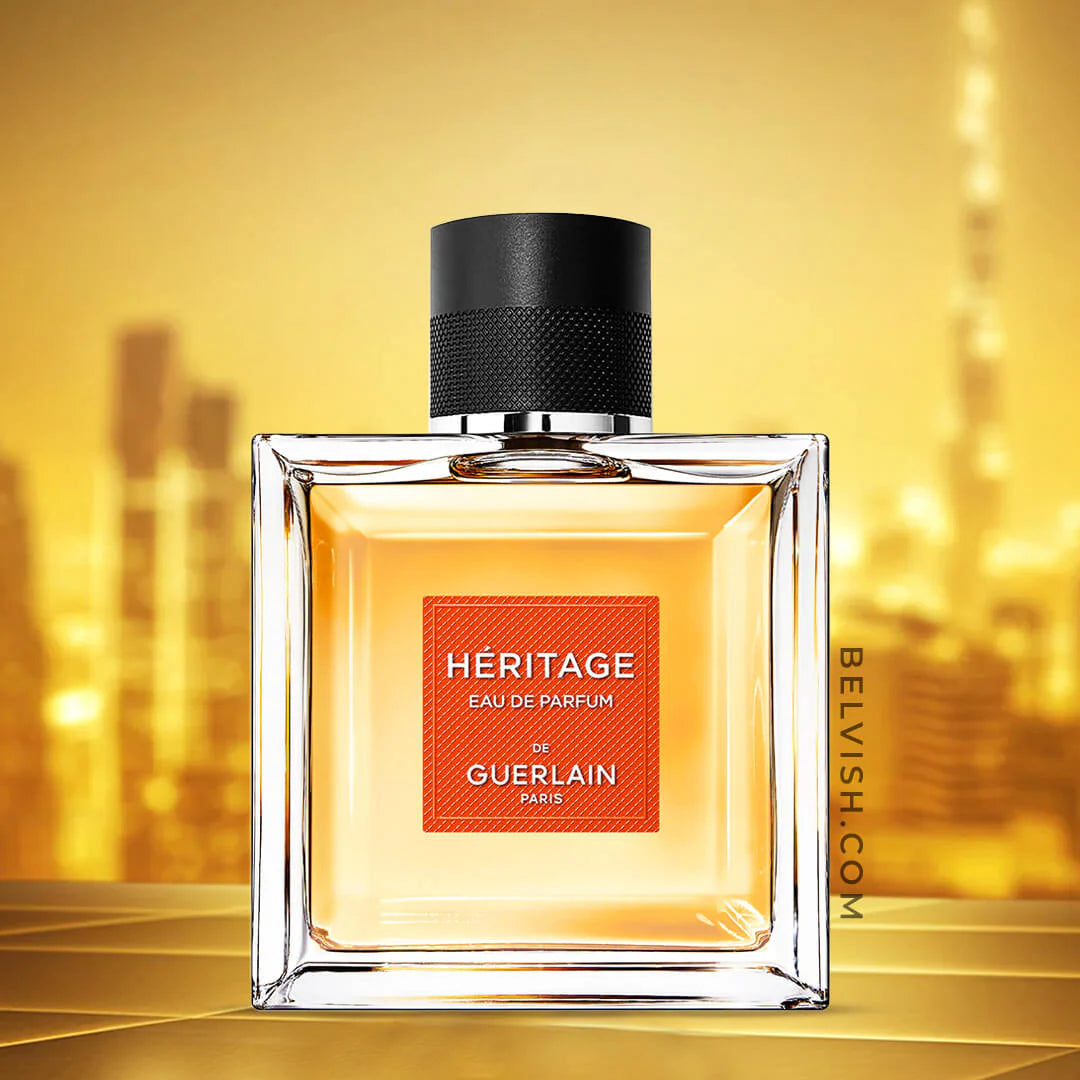 Perfume bottle labeled 'Heritage' by Guerlain on a gold background
