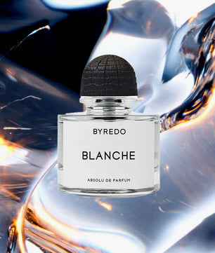 BYREDO Blanche perfume bottle on a dynamic background