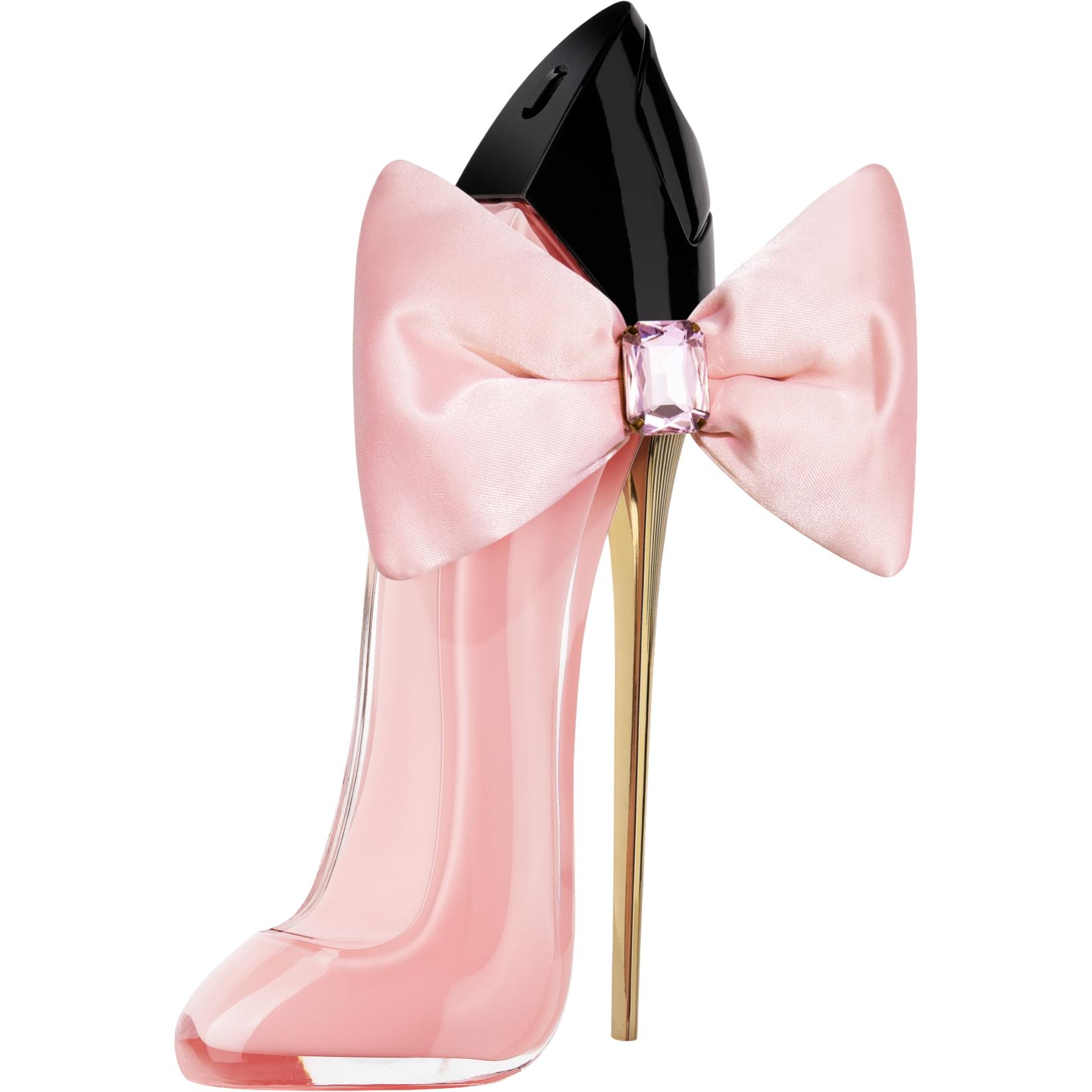 Pink high-heeled shoe-shaped perfume bottle with a large bow on a white background
