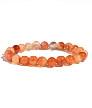 Beaded bracelet with orange and red beads on a white background