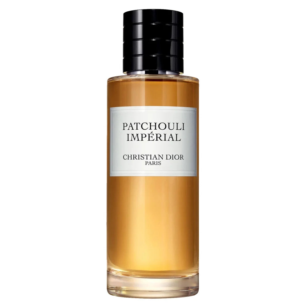 Christian Dior Patchouli Impérial perfume bottle with amber liquid, a white label, and a black cap on a white background.