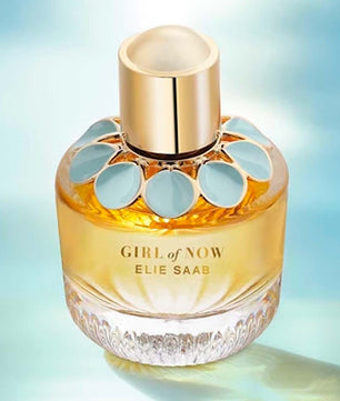 Perfume bottle labeled 'Girl of Now' by Elie Saab on a gradient blue background