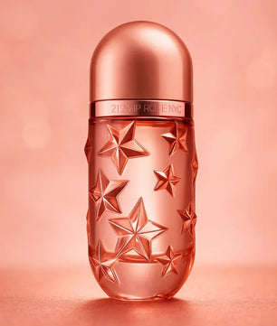 Perfume bottle with star design on a pink background