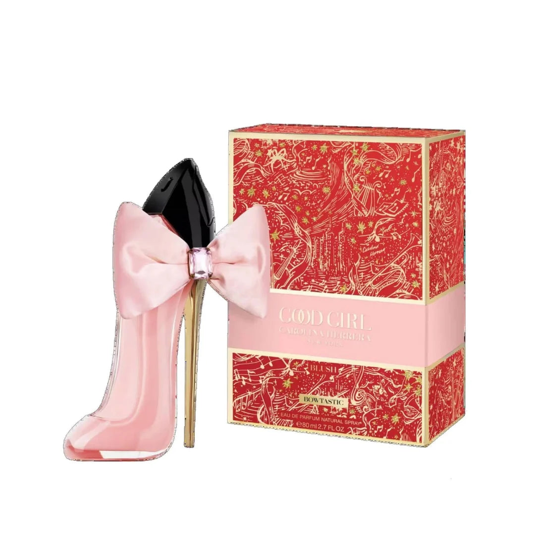 Pink high-heeled shoe with a bow next to its packaging on a white background