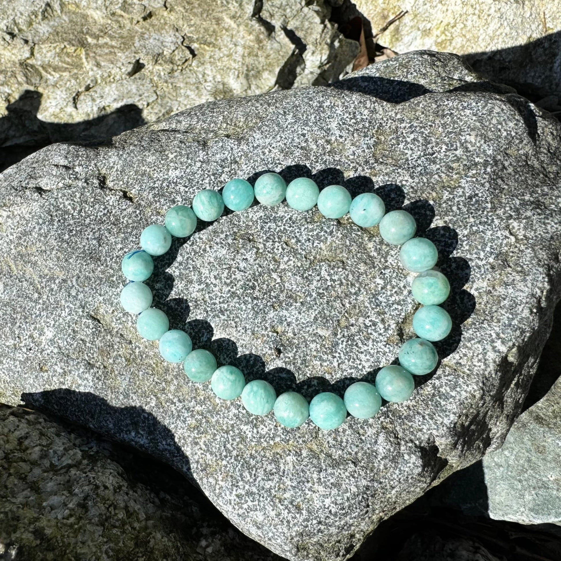 Turquoise beaded bracelet on a rock