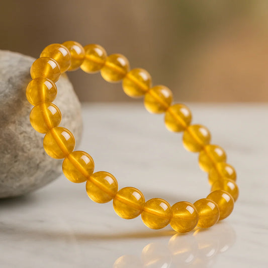 Yellow beaded bracelet on a neutral background