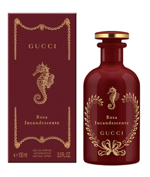 Gucci Rosa Incandescente Eau de Parfum bottle and matching box, both in deep burgundy with gold detailing and a seahorse motif, on a white background.