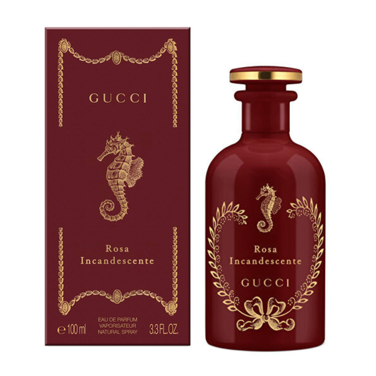 Gucci Rosa Incandescente Eau de Parfum bottle and matching box, both in deep burgundy with gold detailing and a seahorse motif, on a white background.