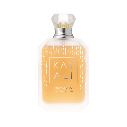 KAY ALI The Wedding Silk Sandal 36 bottle, featuring a clear faceted cap, a silver neck collar, and a frosted glass body filled with a warm golden-yellow liquid. The front label has a gold border with the brand name 'KAY ALI' in gold lettering, and delicate vertical dotted lines decorate the glass.