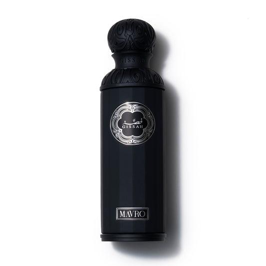Black perfume bottle with decorative cap on a white background