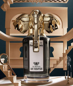 Decorative bottle with gold accents on a classical architectural background