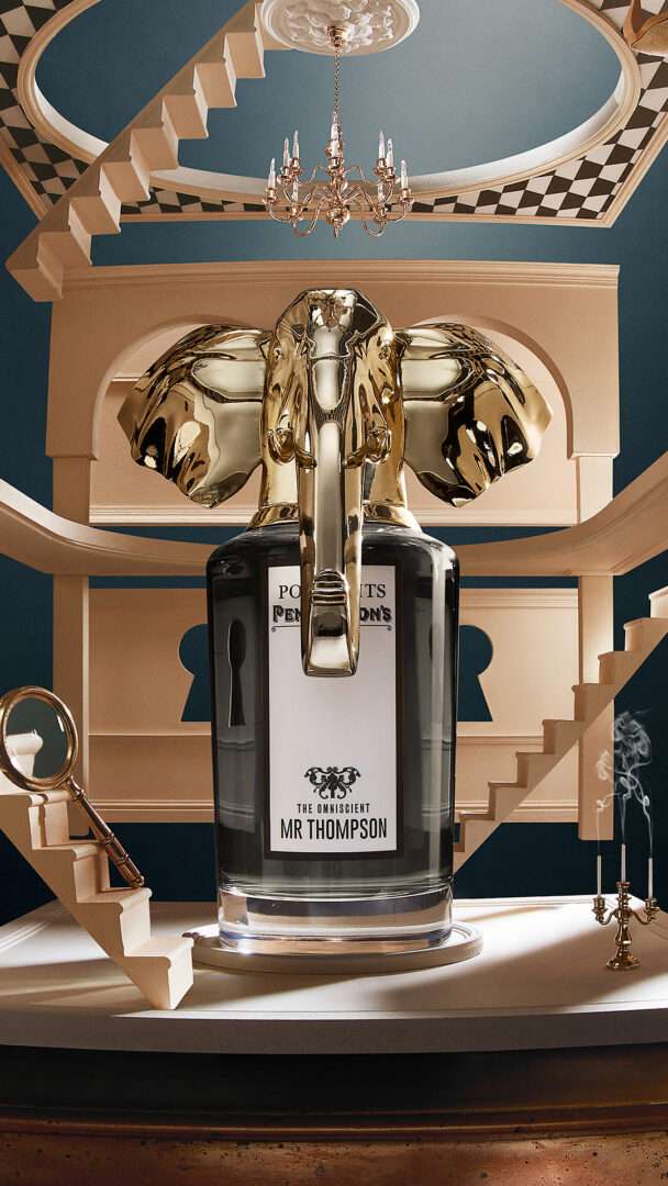 Decorative bottle with gold accents on a classical architectural background