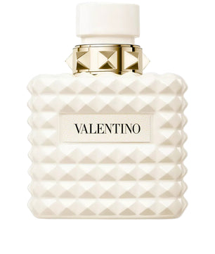 Valentino perfume bottle with white diamond pattern and gold cap on a white background
