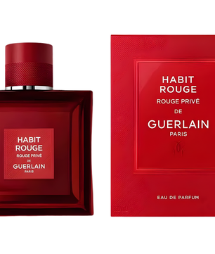 Red Guerlain perfume bottle and packaging on a white background