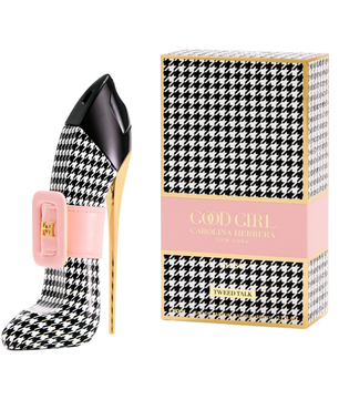 Black and white houndstooth patterned high-heeled shoe with pink heel and matching box on a white background