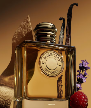 Burberry perfume bottle with vanilla bean, lavender, and raspberry on a warm background