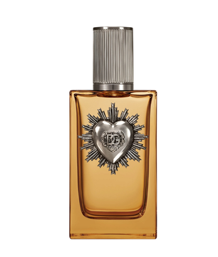 Perfume bottle with decorative heart emblem on a white background