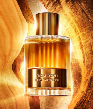 Tom Ford perfume bottle with a gold design on a textured gold background